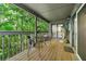 Enjoy the outdoors on this cozy back patio with seating surrounded by lush trees at 1424 Tuxworth Cir, Decatur, GA 30033
