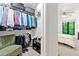 Spacious walk-in closet with organized shelving, hanging racks, and ample storage space for clothing at 1424 Tuxworth Cir, Decatur, GA 30033