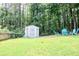 Backyard shed and seating area for relaxing outside at 1890 Turtle Creek Way, Lawrenceville, GA 30043