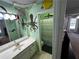 Themed bathroom with ocean decor, playful painting, fun shower curtain, and modern fixtures at 1890 Turtle Creek Way, Lawrenceville, GA 30043