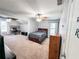 Spacious bedroom featuring neutral carpet, ceiling fan, with additional desk space, and natural light at 1890 Turtle Creek Way, Lawrenceville, GA 30043
