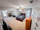 Spacious bedroom featuring neutral carpet, ceiling fan, with additional desk space, and natural light at 1890 Turtle Creek Way, Lawrenceville, GA 30043
