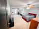 Spacious bedroom featuring neutral carpet, ceiling fan, with additional desk space, and natural light at 1890 Turtle Creek Way, Lawrenceville, GA 30043