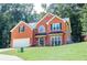 Well-maintained brick home with lush front lawn and mature trees offering curb appeal at 1890 Turtle Creek Way, Lawrenceville, GA 30043