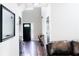 Open foyer leading to living area featuring hardwood floors and neutral walls at 1890 Turtle Creek Way, Lawrenceville, GA 30043