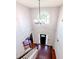 Grand foyer featuring hardwood floors, elegant chandelier, and a large arched window allowing natural light at 1890 Turtle Creek Way, Lawrenceville, GA 30043