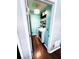 Convenient laundry room featuring a modern washer and dryer, ample storage shelving, and stylish lighting at 1890 Turtle Creek Way, Lawrenceville, GA 30043