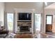 Stylish living room features a fireplace, large windows, and hardwood flooring at 1890 Turtle Creek Way, Lawrenceville, GA 30043