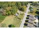 Wide aerial perspective of a lot with two buildings and residential surroundings with nearby homes at 21 Elm St, Hampton, GA 30228