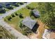 Overhead view of two small buildings, greenery, and surrounding streets in residential neighborhood at 21 Elm St, Hampton, GA 30228