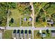 Aerial view of a .31 acre lot nestled among trees and surrounding neighborhood streets at 21 Elm St, Hampton, GA 30228