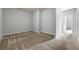 A minimalist bedroom offers ample space and neutral tones, perfect for relaxation at 7177 Fringe Flower Dr, Austell, GA 30168