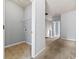 Practical laundry area with space for appliances and storage, connecting to a carpeted hallway at 7177 Fringe Flower Dr, Austell, GA 30168