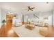 Inviting living area featuring hardwood floors, neutral paint, and easy access to the kitchen at 7177 Fringe Flower Dr, Austell, GA 30168
