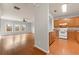 Open-concept living area showcasing hardwood floors and seamless flow into the kitchen at 7177 Fringe Flower Dr, Austell, GA 30168