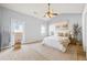 Bright main bedroom with vaulted ceiling, ceiling fan, and private balcony access at 7177 Fringe Flower Dr, Austell, GA 30168