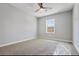 Spacious bedroom features plush carpeting and large windows, offering natural light and comfort at 1382 Bennett Rd, Grayson, GA 30017