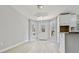 Bright dining area with modern chandelier, white trim, and convenient access to the exterior at 1382 Bennett Rd, Grayson, GA 30017
