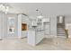 Bright, modern kitchen with white cabinets, an island with granite countertops, and stainless steel appliances at 1382 Bennett Rd, Grayson, GA 30017