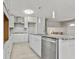 Modern kitchen with white cabinets, granite countertops, stainless steel appliances, and a spacious island at 1382 Bennett Rd, Grayson, GA 30017