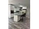 Modern kitchen with white cabinets, granite countertops, stainless steel appliances, and a kitchen island at 1382 Bennett Rd, Grayson, GA 30017
