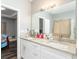 Bathroom featuring double sinks and a large mirror at 2221 Baker Carter Dr, Loganville, GA 30052
