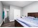 Bright bedroom with wood floors and double closet doors at 2221 Baker Carter Dr, Loganville, GA 30052