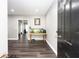 Stylish entryway with dark wood floors, gray walls, an aquarium, and a view to a living space at 2221 Baker Carter Dr, Loganville, GA 30052