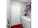 Laundry room with stacked washer and dryer at 2221 Baker Carter Dr, Loganville, GA 30052
