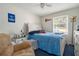 This bedroom features a ceiling fan and natural light from the window at 2950 Springfield Sw Ct, College Park, GA 30349