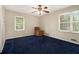 Bedroom featuring a neutral color scheme, ample natural light, and a comfortable chair at 2950 Springfield Sw Ct, College Park, GA 30349