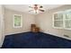 Simple bedroom with blue carpeting and ample light from large window at 2950 Springfield Sw Ct, College Park, GA 30349