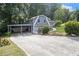 View of the home showing driveway and attached carport to side of the home at 2950 Springfield Sw Ct, College Park, GA 30349