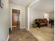 Inviting foyer with tile flooring leading to the living room with comfortable seating at 2950 Springfield Sw Ct, College Park, GA 30349