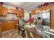 View of kitchen with stainless steel refrigerator, and glass-top kitchen table at 2950 Springfield Sw Ct, College Park, GA 30349