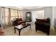 View of Living room with comfortable seating and view of front windows at 2950 Springfield Sw Ct, College Park, GA 30349