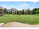 Well-manicured backyard featuring lush green lawn, mature trees, and a swing set at 337 Spotted Ridge Cir, Woodstock, GA 30188