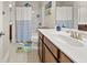Bathroom with a single sink vanity and view of the toilet and tub/shower combo at 337 Spotted Ridge Cir, Woodstock, GA 30188