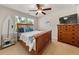 Bedroom with a surfboard and a ceiling fan and two windows for natural light at 337 Spotted Ridge Cir, Woodstock, GA 30188