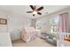 Bedroom featuring a play tent, reading nook, and natural light from two windows at 337 Spotted Ridge Cir, Woodstock, GA 30188