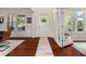 Elegant entryway with hardwood floors, white trim, and large windows for ample natural light at 337 Spotted Ridge Cir, Woodstock, GA 30188