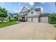 Stately home featuring a long driveway and a three-car garage at 337 Spotted Ridge Cir, Woodstock, GA 30188