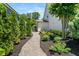 Lush landscaping along the stone-paved walkway leading to the house, enhancing its curb appeal at 337 Spotted Ridge Cir, Woodstock, GA 30188