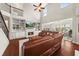Bright living room with a fireplace, built-in shelving, and large windows at 337 Spotted Ridge Cir, Woodstock, GA 30188