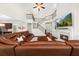 Open-concept living room with hardwood floors, fireplace, and staircase at 337 Spotted Ridge Cir, Woodstock, GA 30188