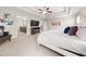 Comfortable main bedroom boasts a tray ceiling, ceiling fan, and plenty of natural light at 337 Spotted Ridge Cir, Woodstock, GA 30188