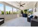 Relaxing sunroom with ample seating, modern furniture, and views of the landscaped backyard at 337 Spotted Ridge Cir, Woodstock, GA 30188