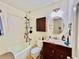Bathroom showcasing a vanity, sink, toilet and bath tub at 792 Oneta Dr, Norcross, GA 30093