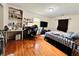 Bedroom with hardwood floors, desk, built-in shelving, and a bed with blue and white bedding at 792 Oneta Dr, Norcross, GA 30093