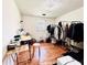 Bedroom with hardwood floors, a small window, garment racks, and a grooming table at 792 Oneta Dr, Norcross, GA 30093